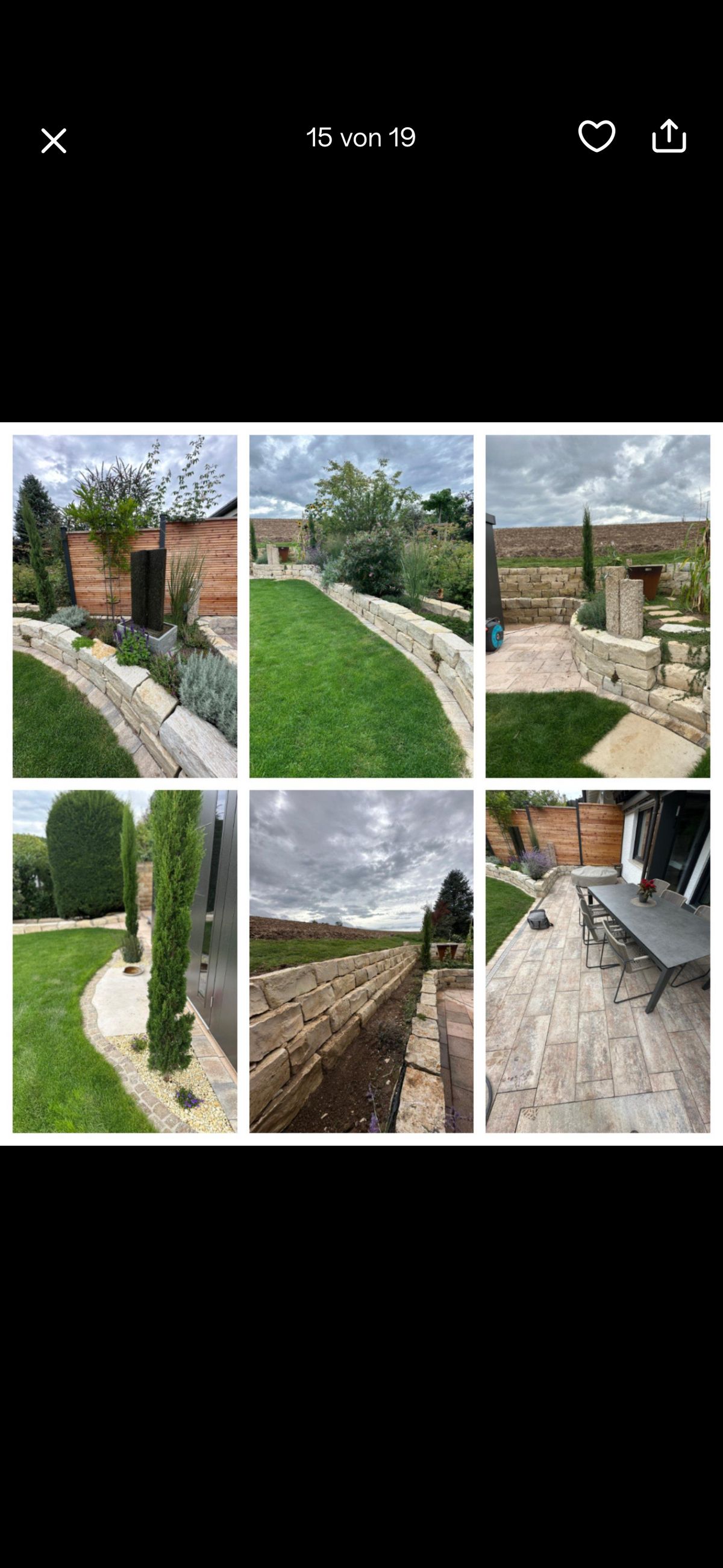 Gestaltete Gartenanlage mit Natursteinmauer